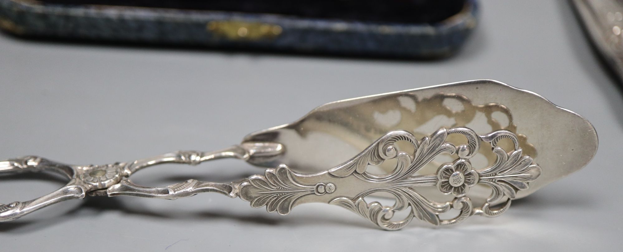 An 830s pastry tongs, a knife, a cased set of six bean end coffee spoons and an infuser.